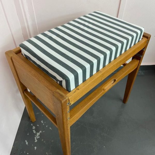 Wooden piano stool with seat reupholstered in a striped fabric