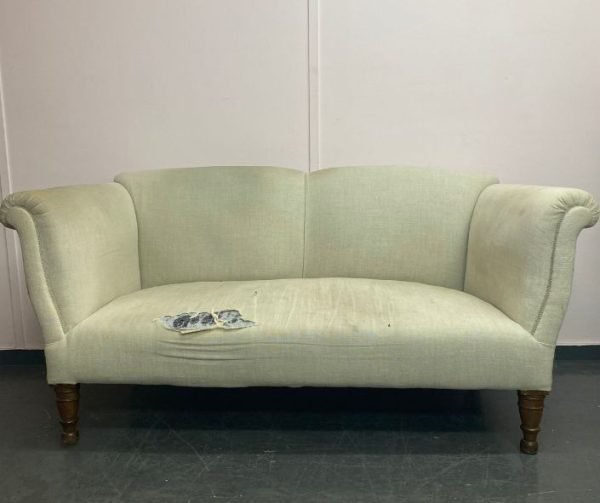 White sofa in need of reupholstery