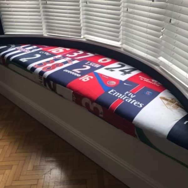 Window seat cushions – Vintique Upholstery Window seat cushions covered in a fabric showing sports shirts