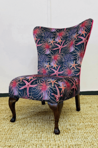 The old velvet fringe chair now reupholstered in a patterned pink velvet called Rockpooling, from Stella Alexander.