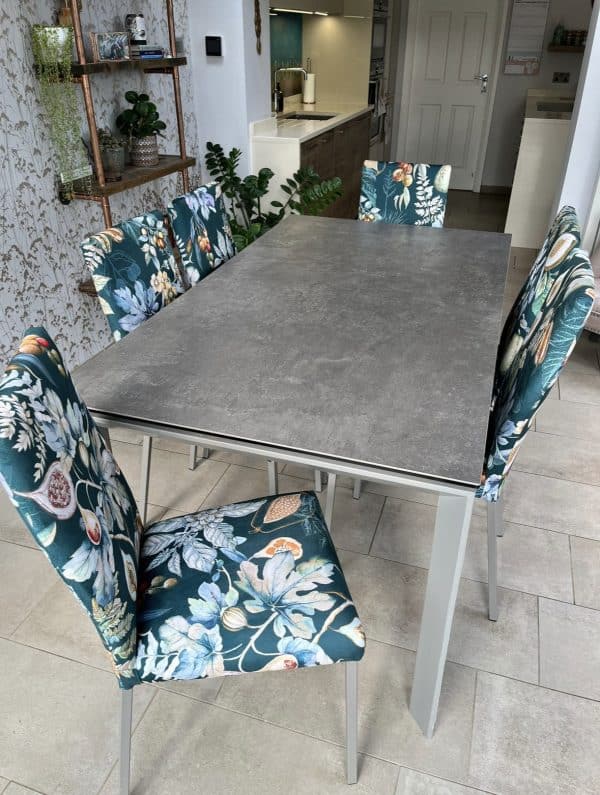 Dining chairs and table. Chairs covered in Prestigious Textiles Borneo Velvet