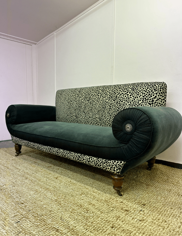 A spotted velvet sofa that has been reupholstered by an expert