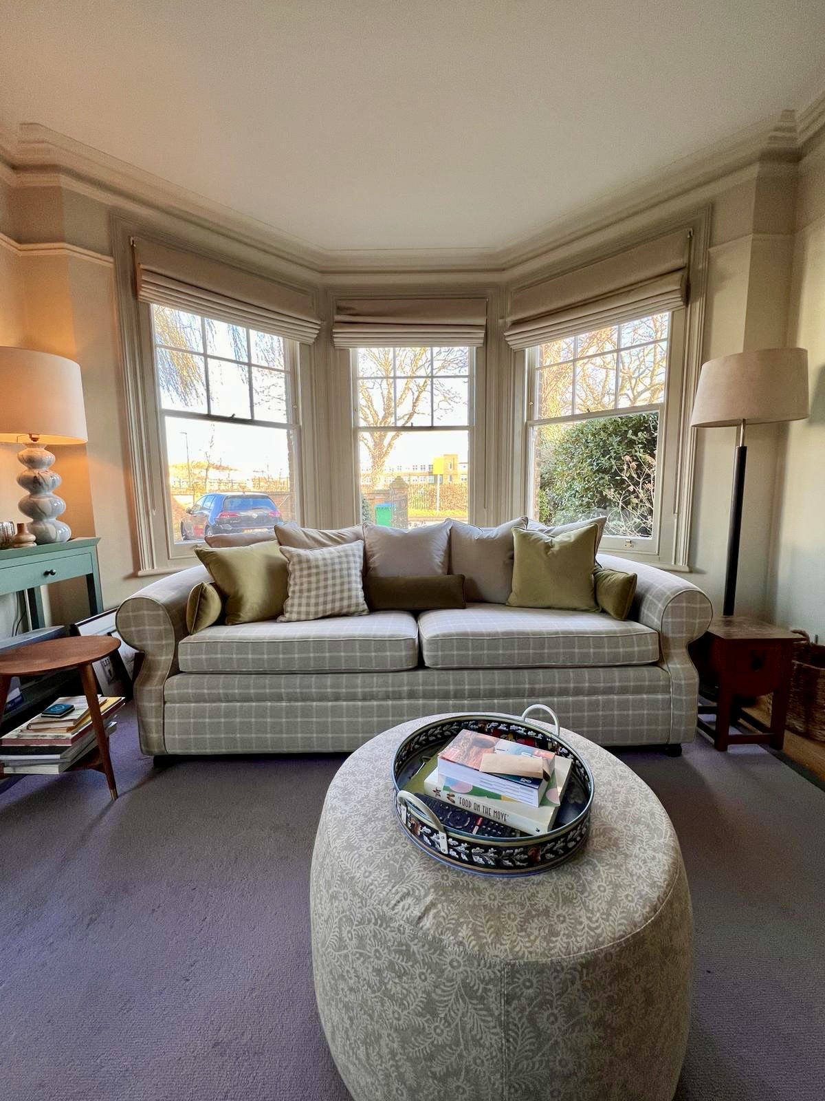 A sofa that has been reupholstered in neutral colours by an expert