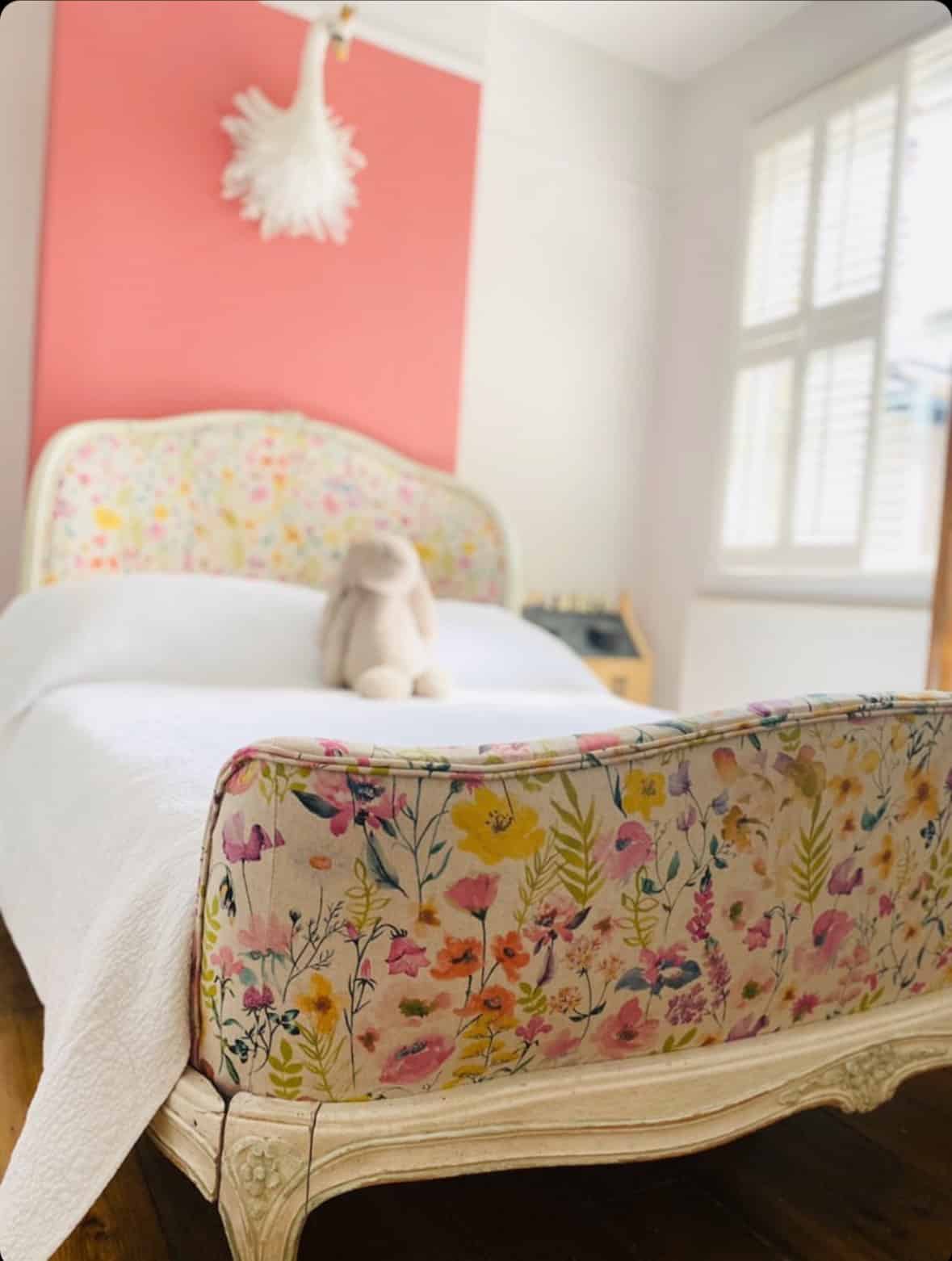 A bed post that has been reupholstered by an expert