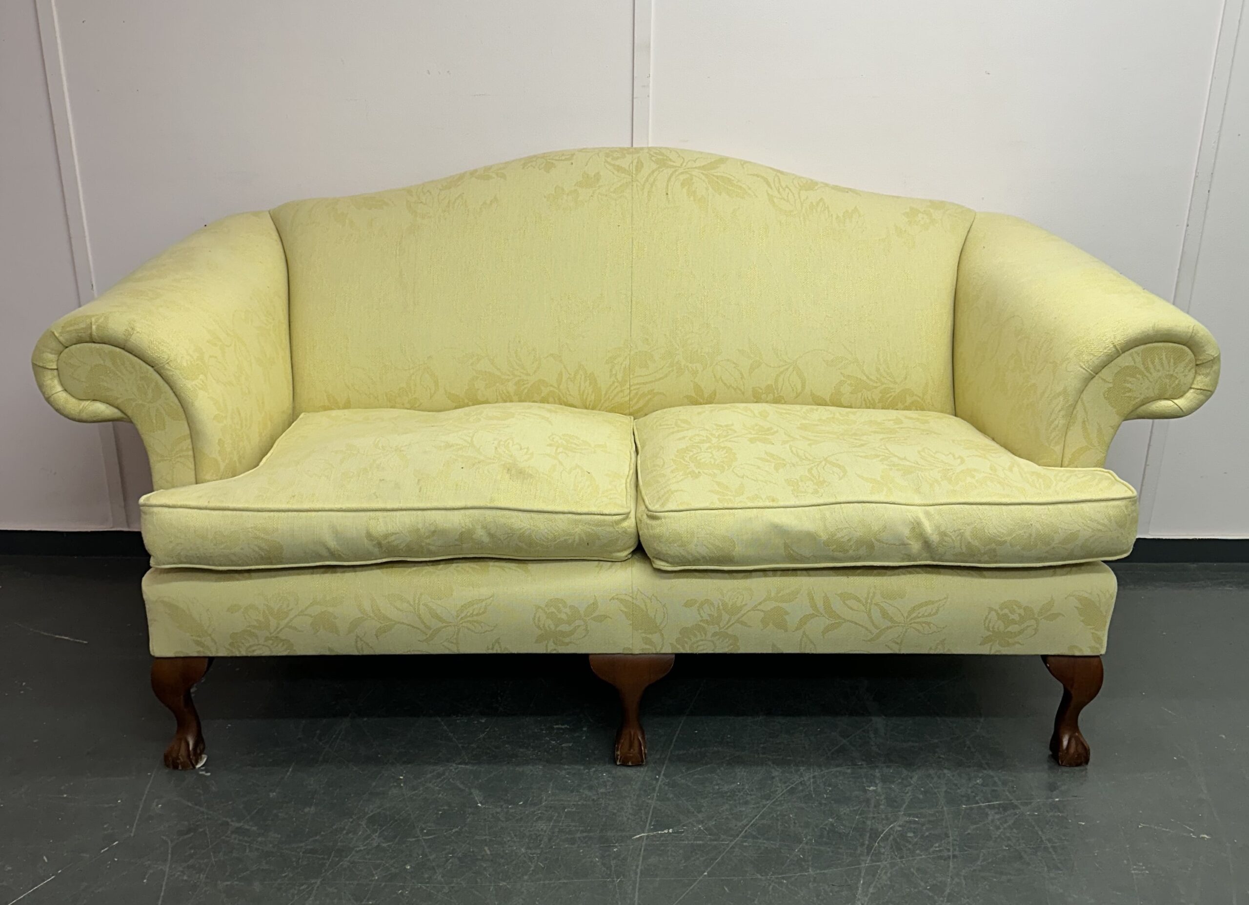 A yellow Wesley Barrell sofa before it has been reupholstered
