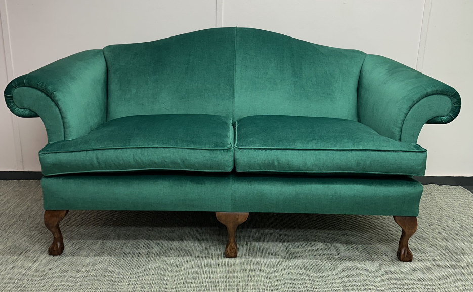 A beautifully reupholstered Wesley Barrell sofa in an emerald velvet