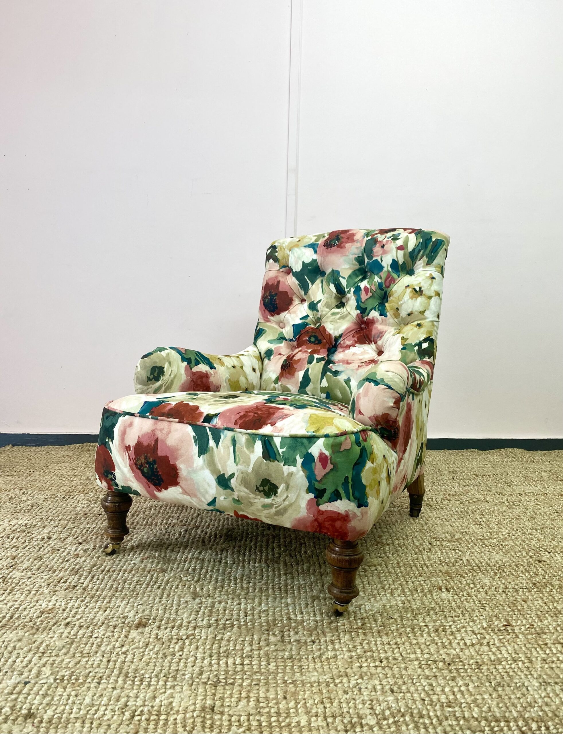 A chair that has been expertly upholstered in a floral pattern