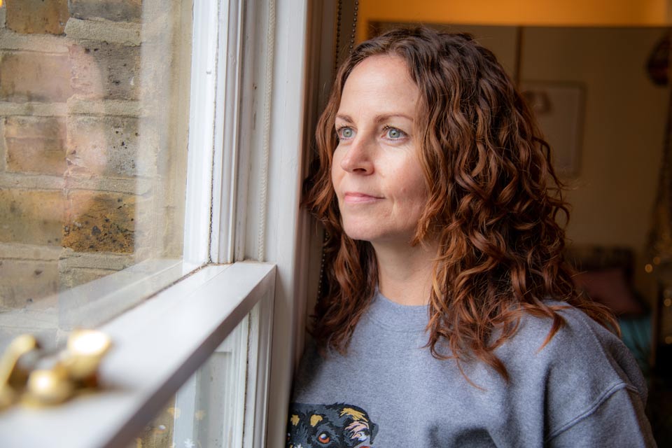 Sharon O'Conner - Vintique Upholstery owner looking out of window