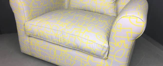 Cuddle chair reupholstered in a graphic pattern fabric