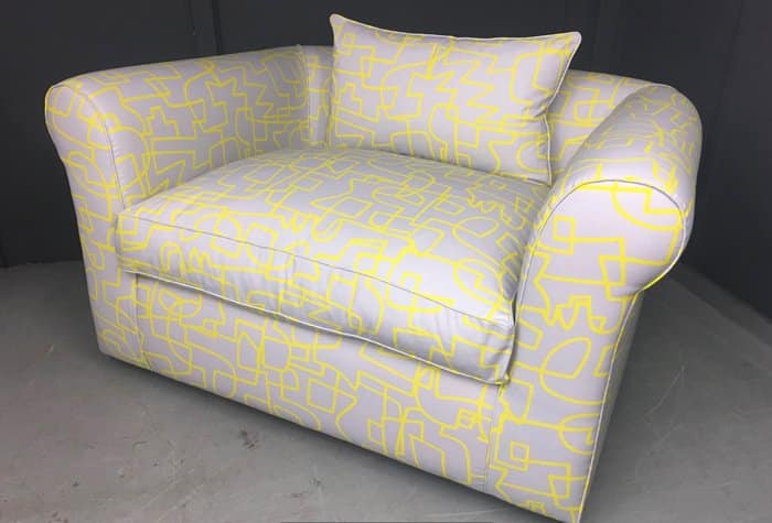 Cuddle chair reupholstered in a graphic pattern fabric
