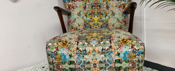 Very Vintique upholstered chair from the Danish Mid Century modern era in a patterned fabric