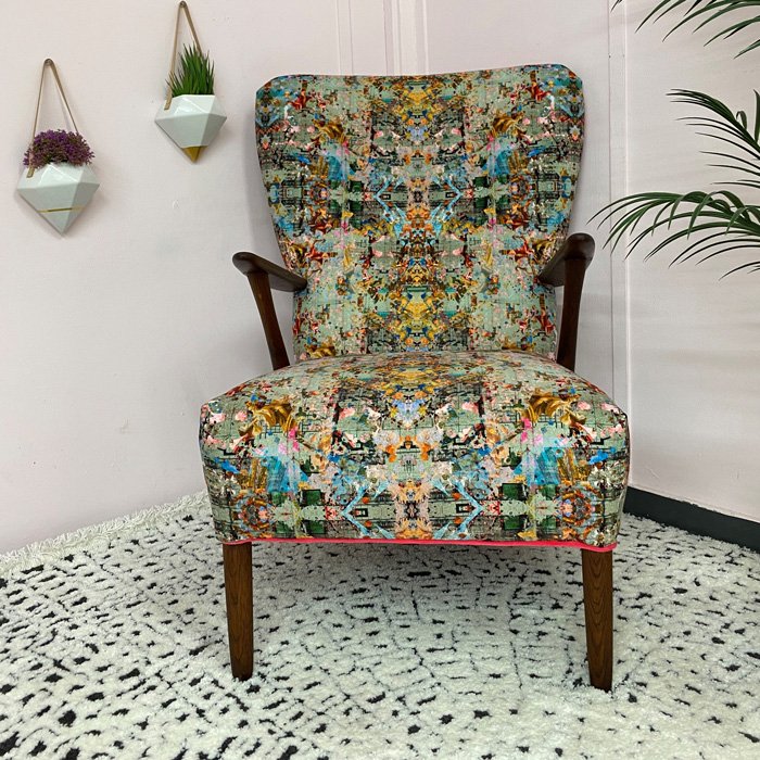 Very Vintique upholstered chair from the Danish Mid Century modern era in a patterned fabric