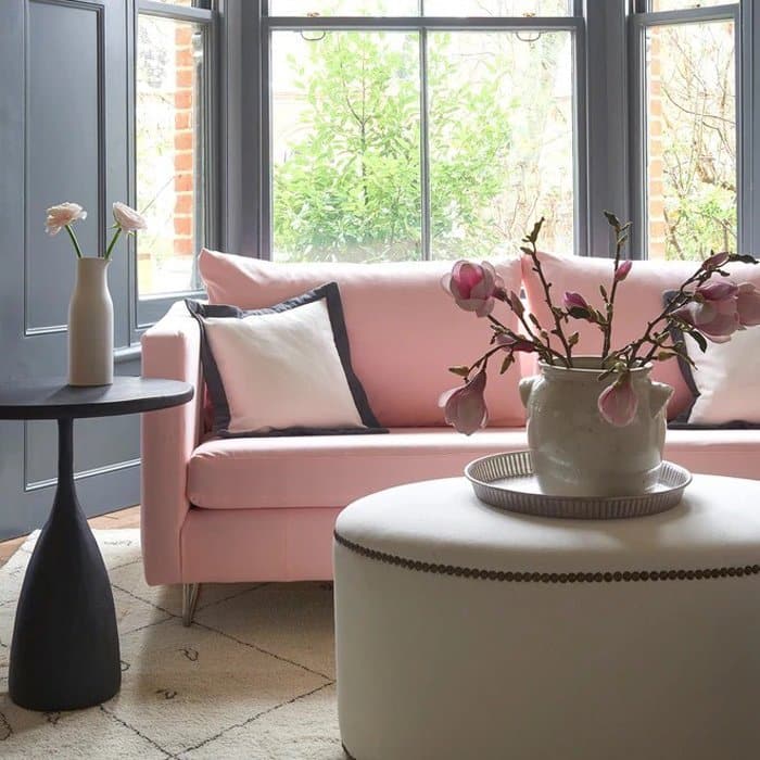 Linwood Fabrics sofa featuring pink recycled fabric from their Verde collection in a lounge