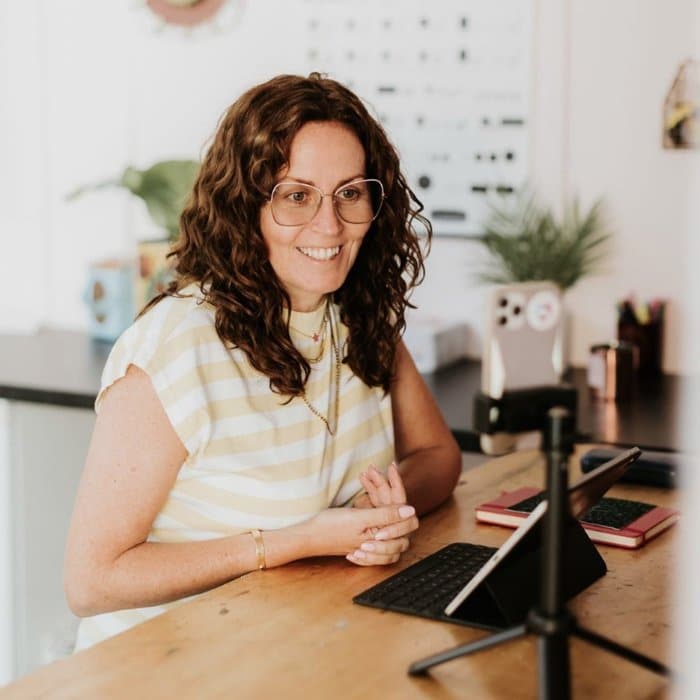 Vintique Upholstery's Sharon O'Connor on a Power Hour call talking into the phone