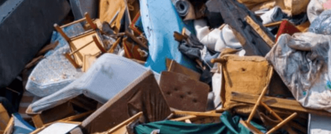 A large pile of furniture waste at landfill