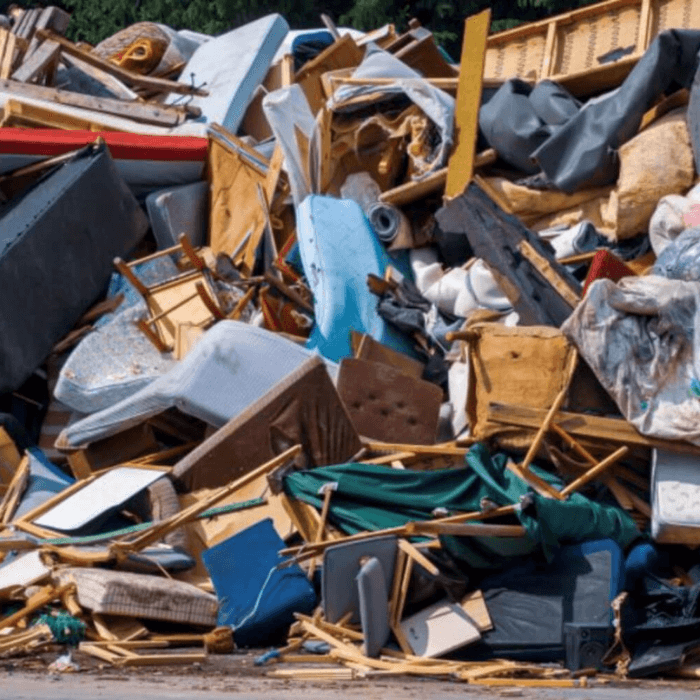 A large pile of furniture waste at landfill