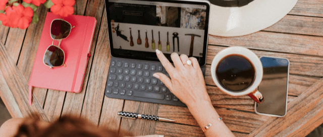 Sharon on laptop with upholstery beginners starter guide open on the screen.