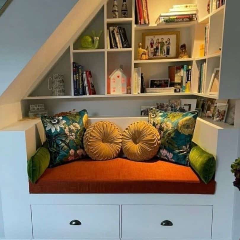 Reading Nook Cushions in assorted fabrics on an orange fabric bench cushion