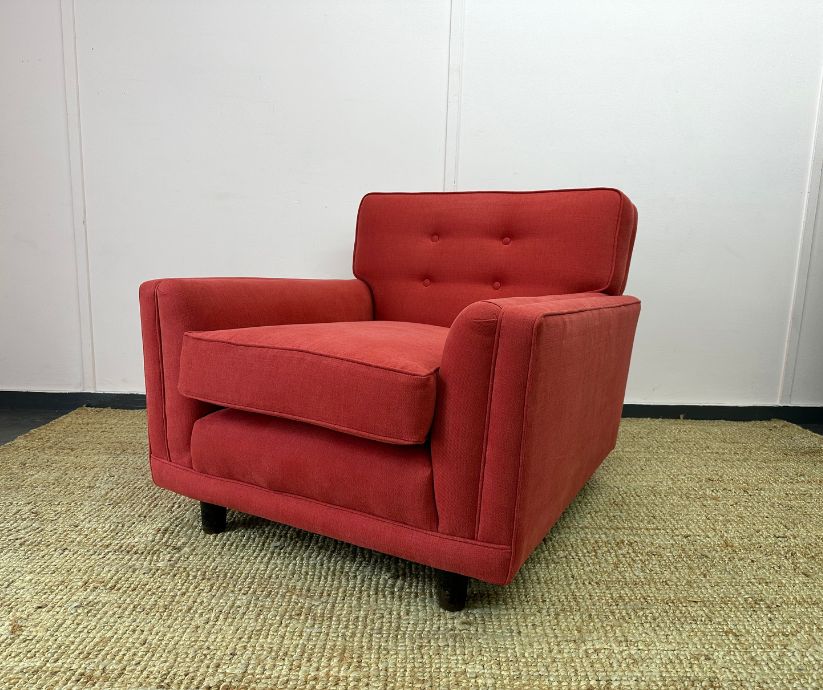 Red upholstered armchair