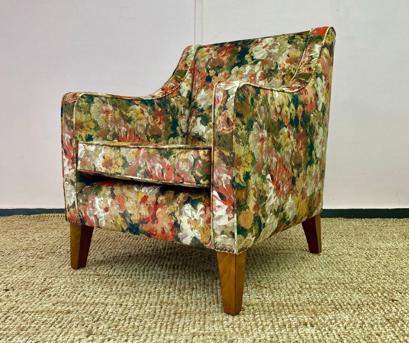 Reupholstered small armchair with a floral print