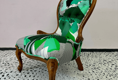 The Joyful Chair features pattern-matched buttons and self piping.