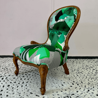 The Joyful Chair features pattern-matched buttons and self piping.