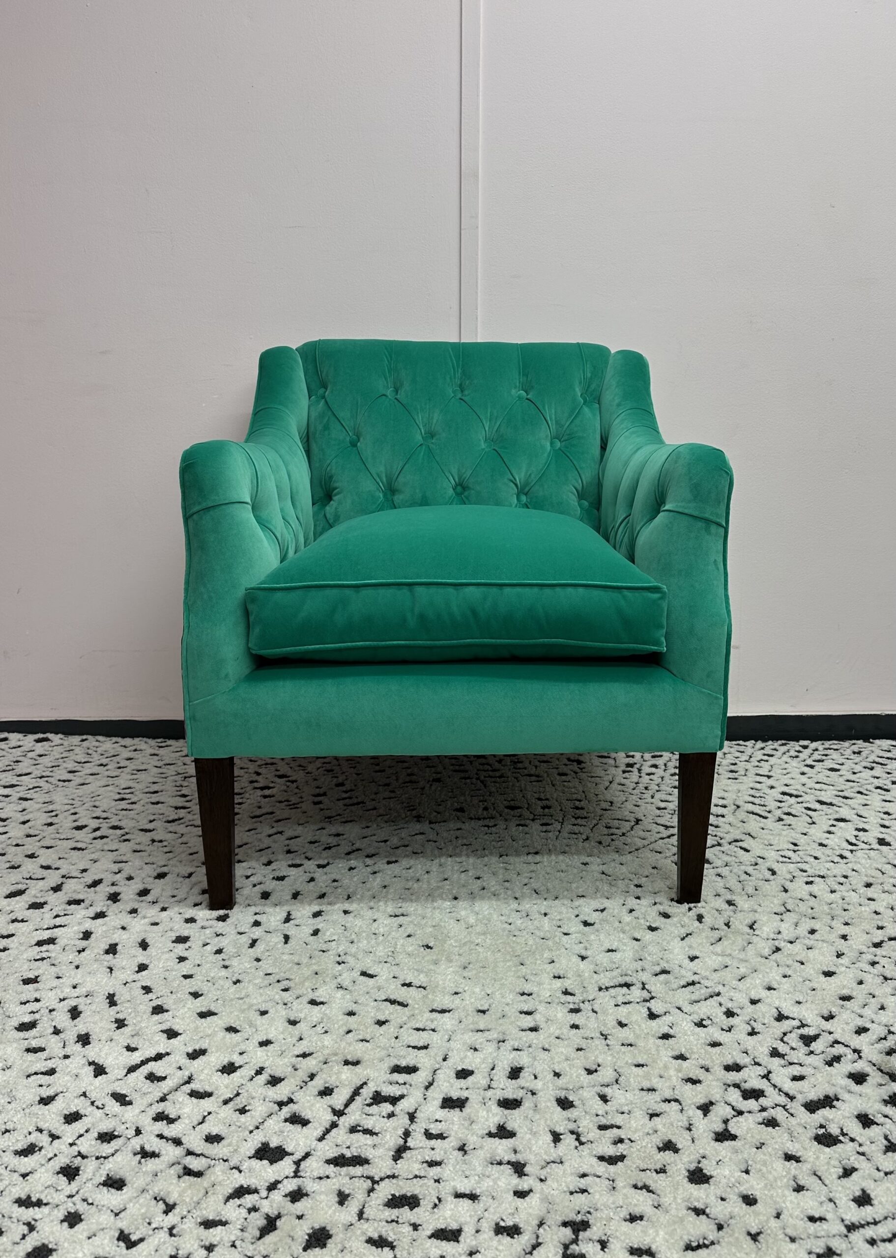 Green chair (2)-min A green armchair with a floral patten that has been expertly reupholstered